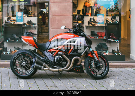 STRASBOURG, FRANCE - OCT 28, 2017: new Ducati Diavel motorcycle parked on a french street near showcase window. Ducati Diavel is the second cruiser motorcycle from Ducati Stock Photo