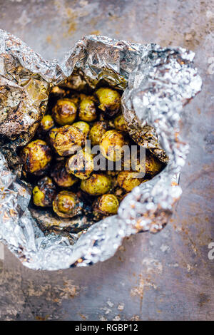 Brussel sprouts baked in aluminium foil Stock Photo