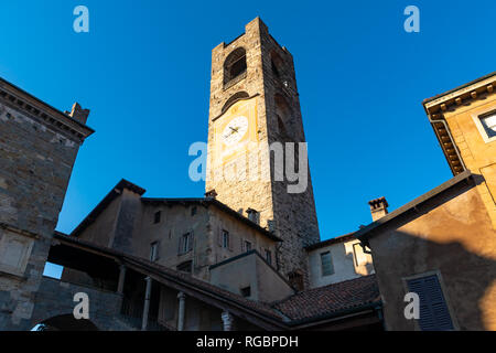 Campanone Civic Tower at main square Piazza Vecchia in Upper Medieval Town in Bergamo Stock Photo