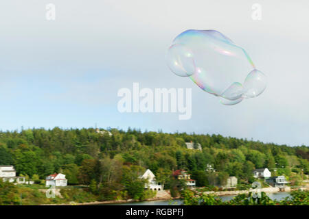 Soap bubble floating in the misty sky near Bar Harbor, Maine. Stock Photo