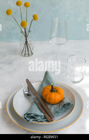 Autumnal table decoration with  decorative gourd Stock Photo