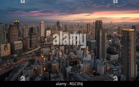 Japan, Osaka, Aerial city view at sunset Stock Photo