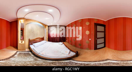 360 degree panoramic view of GRODNO, BELARUS - MARCH 20, 2012: 360 panorama in interior of modern bedroom in red style color. Full 360 degree angle  view seamless panorama in equi
