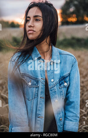 Portrait of young woman wearing denim jacket Stock Photo