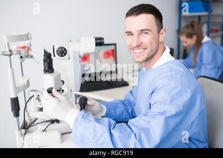 Portrait of smiling lab technician in lab Stock Photo
