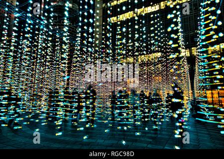 winter lights festival in Canary Wharf, light blobs display and installation, crowd visiting , digital , LED lighting, London, England Stock Photo