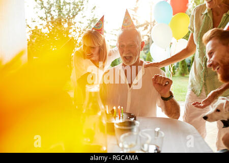 Happy family on a garden birthday party Stock Photo