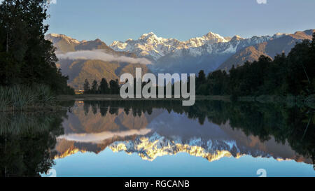 late afternoon shot of mt cook reflected in the waters of lake matheson in new zealand Stock Photo