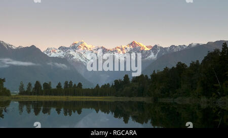 a shot of mt cook and lake matheson at sunset in new zealand Stock Photo