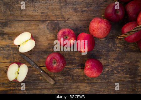 Red apples and knife on wood Stock Photo