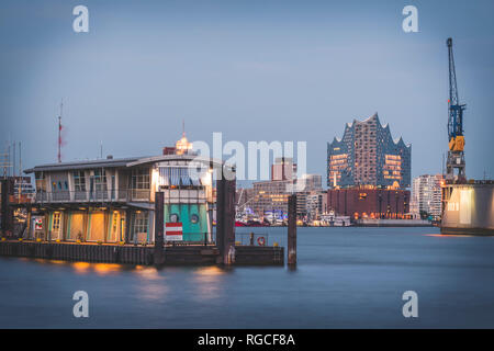 Germany, Hamburg, view over Elbe river to Elbe Philharmonic Hall in the evening Stock Photo
