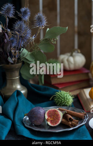Still life with figs and cinnamon sticks Stock Photo