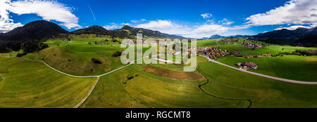 Germany, Bavaria, Swabia, Oberallgaeu, Obermaiselstein and Sonderdorf with fields Stock Photo