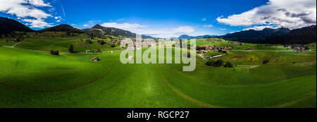 Germany, Bavaria, Swabia, Oberallgaeu, Obermaiselstein and Sonderdorf with fields Stock Photo