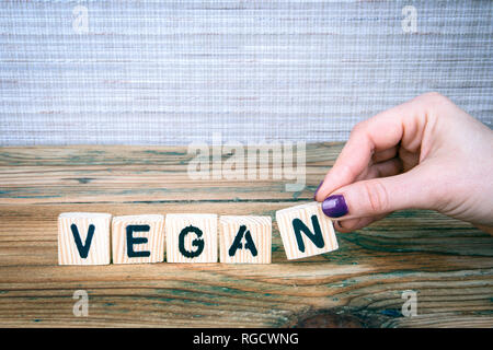 vegan. Wooden letters on the office desk Stock Photo