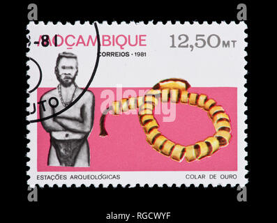 Postage stamp from Mozambique depicting gold beads from Manyikeni Stock Photo