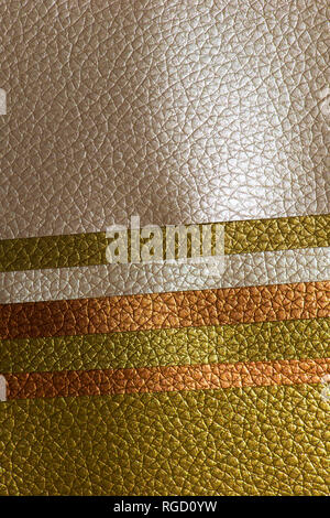 Shiny golden colour leather bright background. Geometric shapes. Brillante superficie backdrop. Abstract compositions. Stock Photo