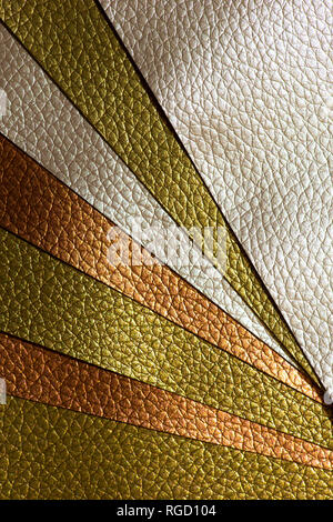 Shiny golden colour leather bright background. Geometric shapes. Brillante superficie backdrop. Abstract compositions. Stock Photo