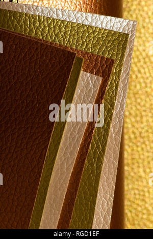 Shiny golden colour leather bright background. Geometric shapes. Brillante superficie backdrop. Abstract compositions. Stock Photo