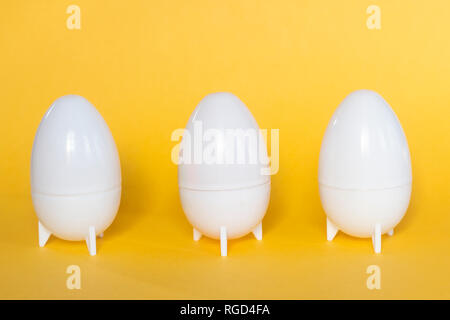 Plastic Easter Eggs on the yellow background Stock Photo
