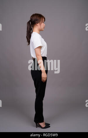 Full length shot of young Asian woman standing Stock Photo