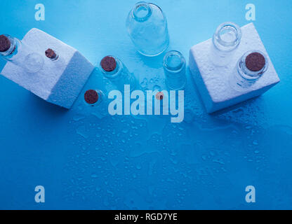 Few transparent bottles, water sprays. empty glass bottles Stock Photo