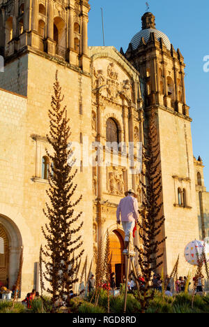 Local man walking on stilts in front of Church of Santo Domingo de Guzman, oaxaca, mexico Stock Photo