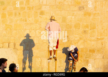 Local men wearing stilts, oaxaca, mexico Stock Photo