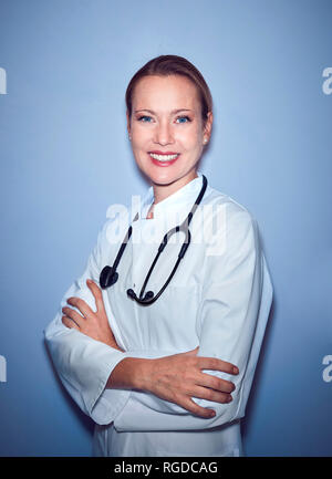 Portrait of smiling female doctor with stethoscope Stock Photo