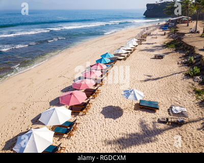 Indonesia, Bali, Aerial view of Balangan beach, sunloungers and beach umbrellas Stock Photo