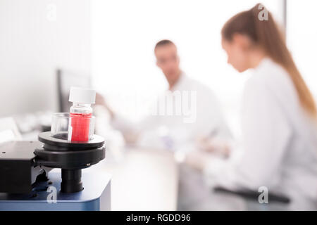 Analyzing sample in lab device Stock Photo