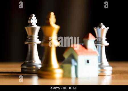 Small house with chess pieces Stock Photo