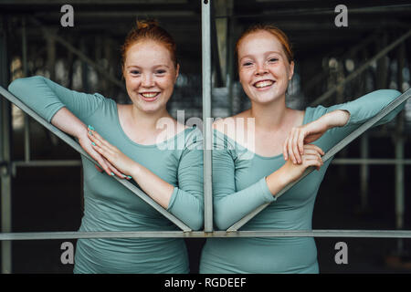 Laughing redheaded twins Stock Photo