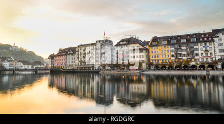 Lucerne, Switzerland - Oct 23, 2018. Views of the famous river promenade of the old town at sunset in Lucerne, Switzerland. Stock Photo