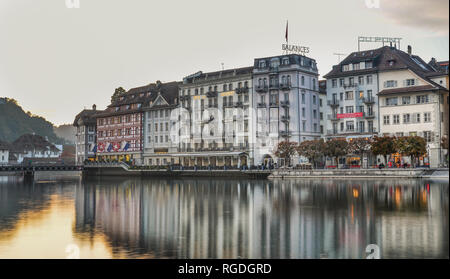 Lucerne, Switzerland - Oct 23, 2018. Views of the famous river promenade of the old town at sunset in Lucerne, Switzerland. Stock Photo