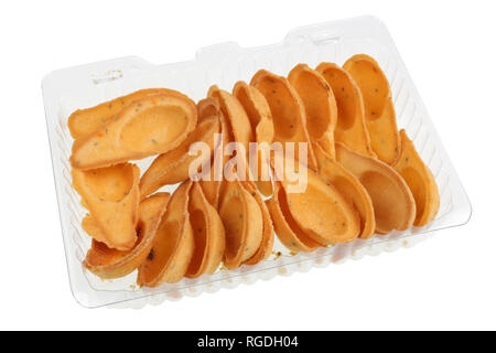 Salty little tartlets with spices in a plastic box. Isolated with patch studio macro Stock Photo