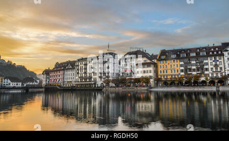 Lucerne, Switzerland - Oct 23, 2018. Views of the famous river promenade of the old town at sunset in Lucerne, Switzerland. Stock Photo