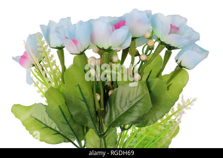 Artificial dead plastic blue flowers with leaves. Isolated on white studio macro shot Stock Photo