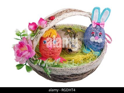 Easter handmade  nest from rope with funny chicken bunny  and eggs. Isolated on white studio macro shot Stock Photo
