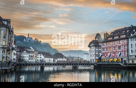 Lucerne, Switzerland - Oct 23, 2018. Views of the famous river promenade of the old town at sunset in Lucerne, Switzerland. Stock Photo