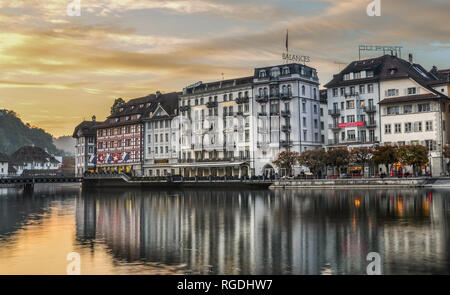 Lucerne, Switzerland - Oct 23, 2018. Views of the famous river promenade of the old town at sunset in Lucerne, Switzerland. Stock Photo