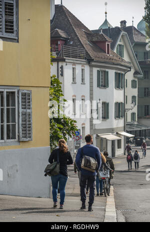 Lucerne, Switzerland - Oct 23, 2018. People walking on the street of Lucerne city along Reuss river coast (Switzerland). Stock Photo