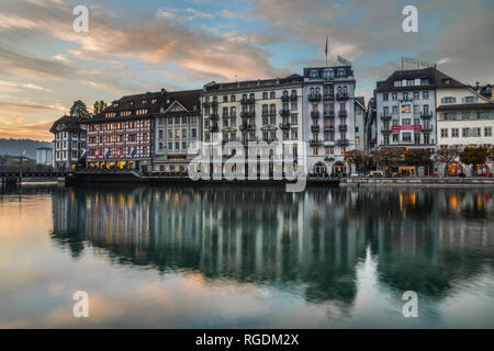 Lucerne, Switzerland - Oct 23, 2018. Views of the famous river promenade of the old town at sunset in Lucerne, Switzerland. Stock Photo