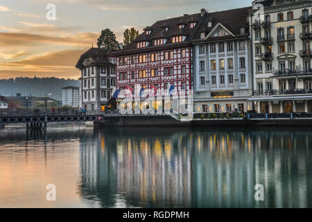 Lucerne, Switzerland - Oct 23, 2018. Views of the famous river promenade of the old town at sunset in Lucerne, Switzerland. Stock Photo