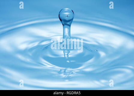 water splash on pure blue water surface Stock Photo