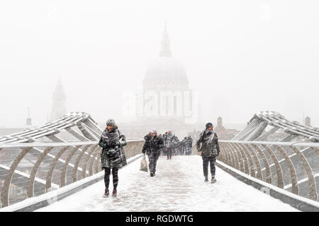 London, UK - March 1st 2018: St Paul's & the Millennium Bridge seen from the bridge in the midst of a snow storm during a sudden cold snap. Stock Photo