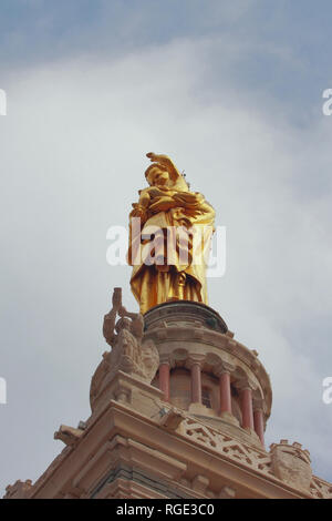 Virgin Mary statue with child on cathedral bell tower. Marseille, France Stock Photo