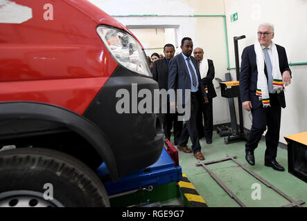 Addis Abeba, Ethiopia. 29th Jan, 2019. Federal President Frank-Walter Steinmeier (2nd from right) visits the Federal Technical and Vocational Education and Training Institute (TVET), a vocational training centre. He wears a scarf with stripes in the Ethiopian national colours at the edge, a present for a guest. Credit: Britta Pedersen/dpa-Zentralbild/dpa/Alamy Live News Stock Photo