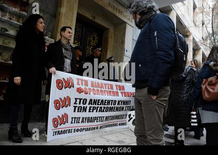 Athens, Greece. 28th Jan, 2019. Protesters seen holding a banner during the demonstration.Tax officials protested as saying for the government plants about moves of employees, complete elastification of labor relations, the introduction of individual contracts out side the ministry of finance. Credit: Giorgos Zachos/SOPA Images/ZUMA Wire/Alamy Live News Stock Photo
