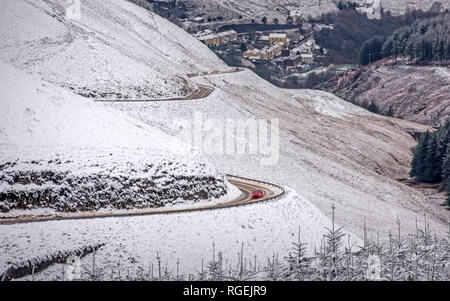 Abergwynfi, South Wales, UK. 29th January, 2019. A lone motorist braves the treacherous and remote A4107 Cwmavon Valley road near Abergwynfi in the Afan Forest Park, South Wales this afternoon as the area was hit with heavy snowfall. Credit: Phil Rees/Alamy Live News Stock Photo